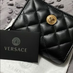 Received this beautiful Authentic Versace wallet. Never used!